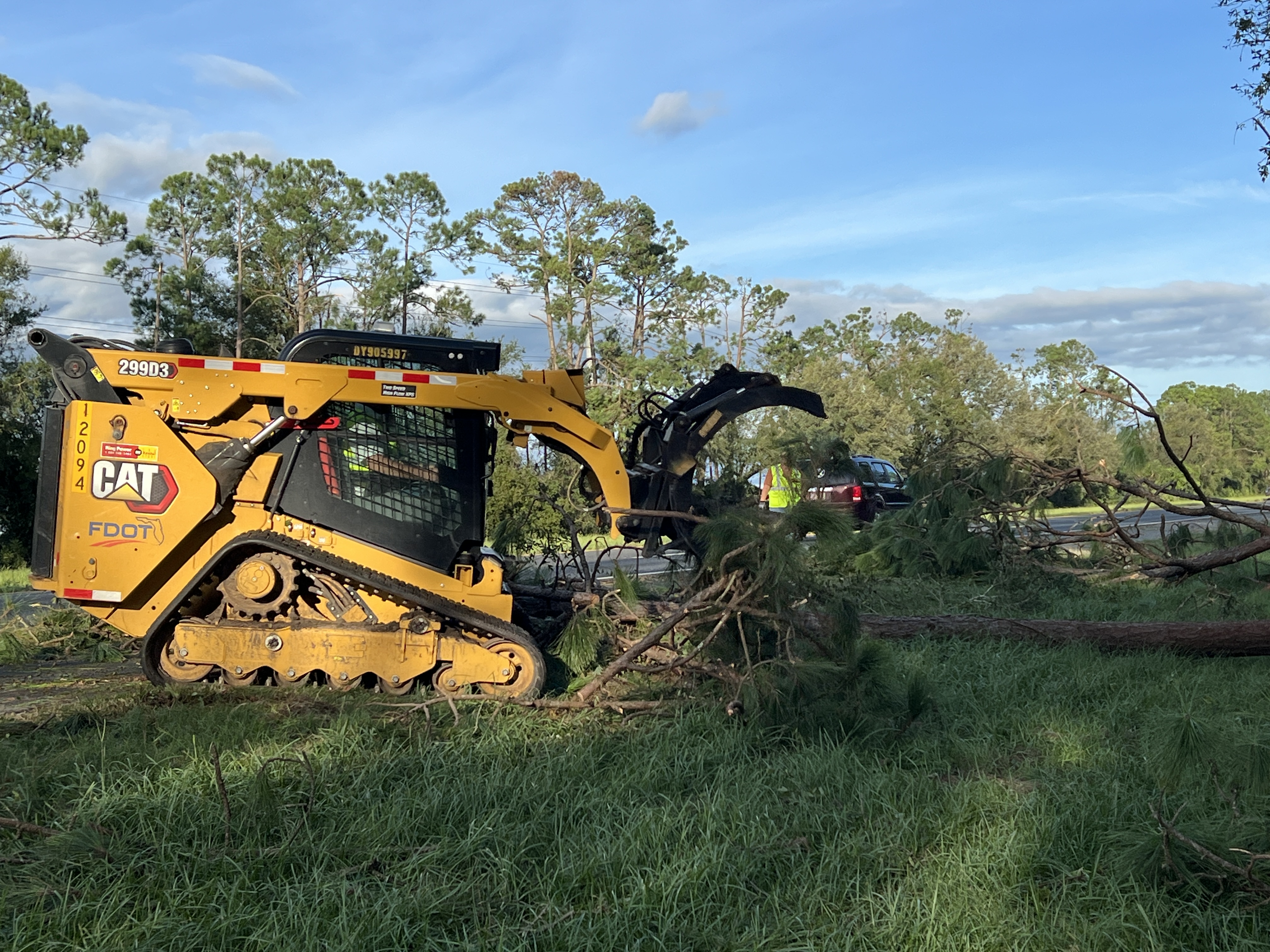 An FDOT Crew moves a downed tree.