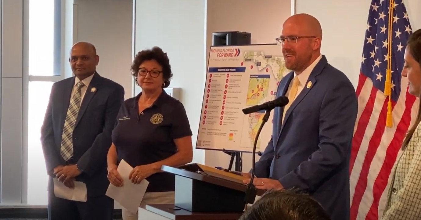 Secretary Jared Perdue speaks at an event.