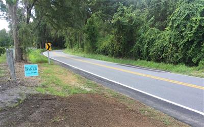 Multiple road shoulder widening improvements facing south of entrance of St. Paul Missionary Baptist Church on Old Bainbridge Road in Leon County