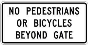 No Pedestrians or Bicycles Beyond Gate sign