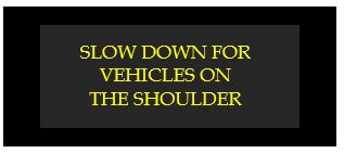 slow down for vehicles on the shoulder