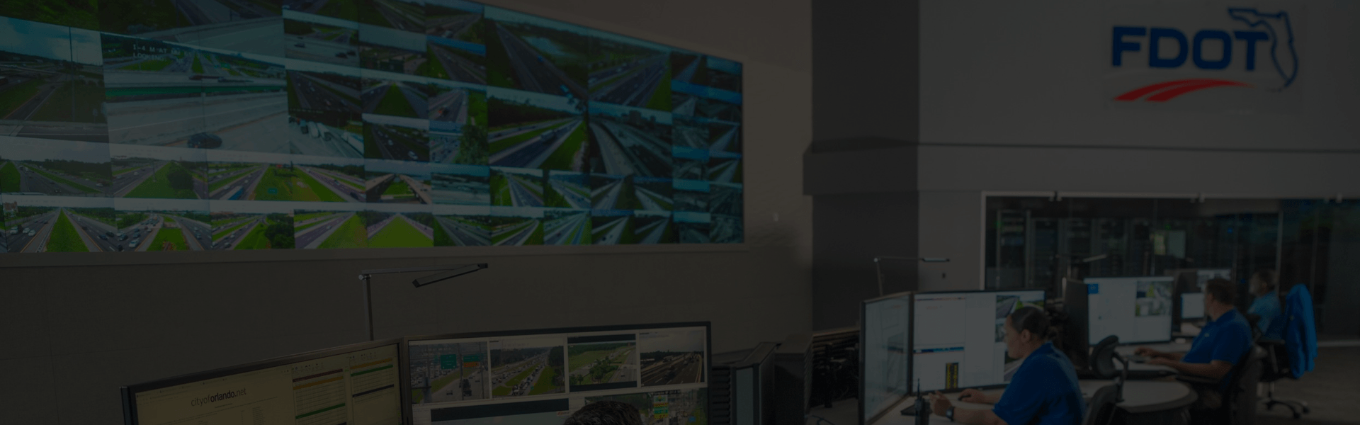 ITS Management and Deployment program overview showing traffic management center monitors